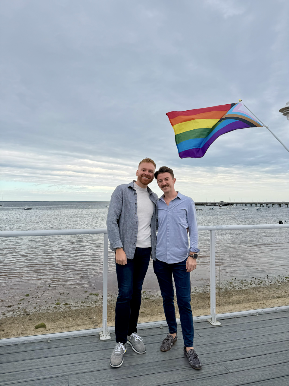 Chad and Zac in Provincetown with pride flag